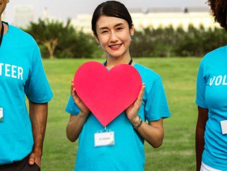 lady holding a paper heart